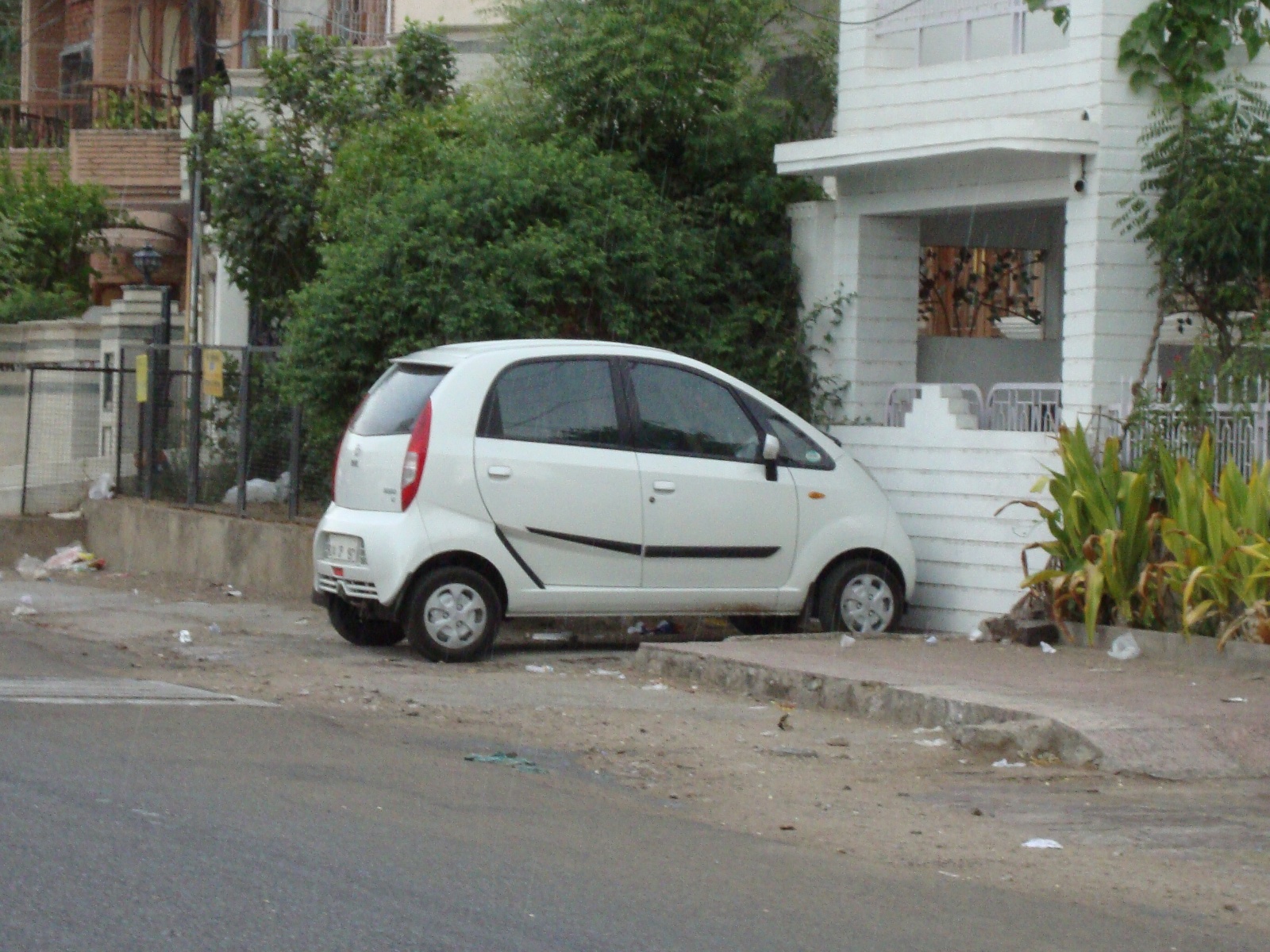 A white Tata Nano. The Nano comes in a variety of other colors, including orange.