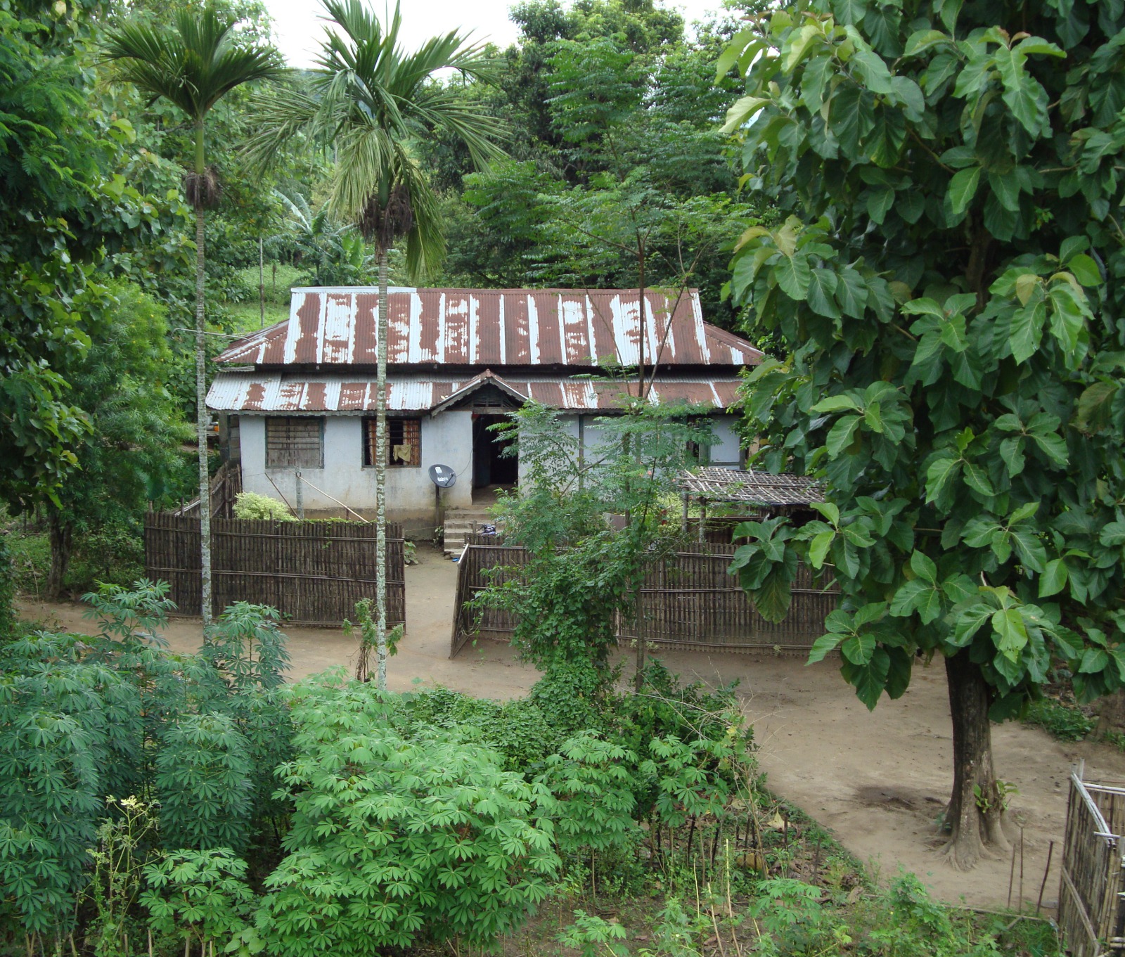 This weathered bungalow in the Garo Hills sports its own satellite dish.
