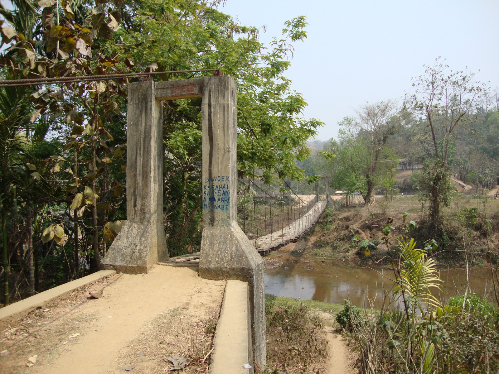 A suspension footbridge over the Jinari River, at Rari.
