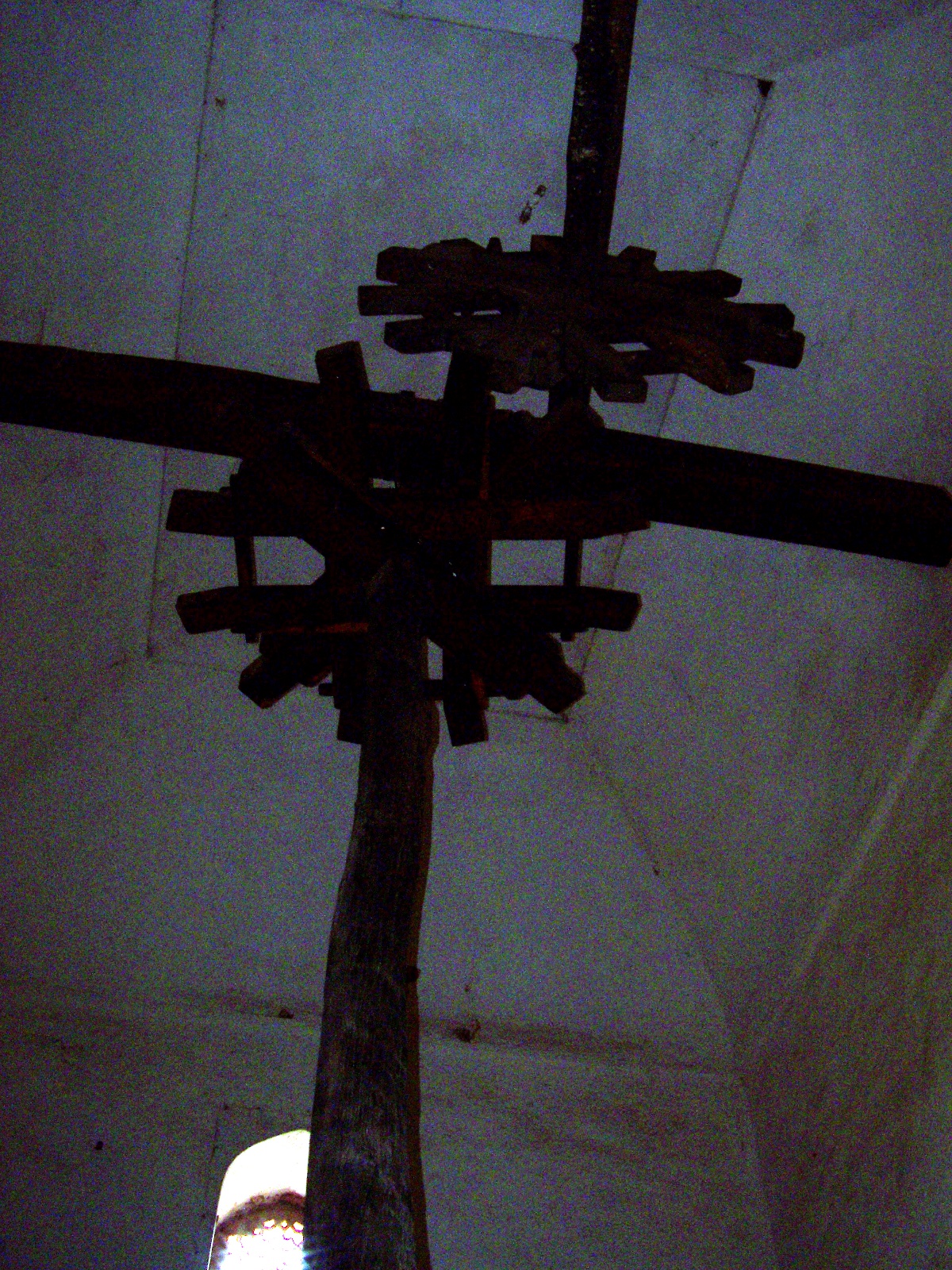 Wooden gears that transferred the power of oxen walking in a circle to the bucket lift.