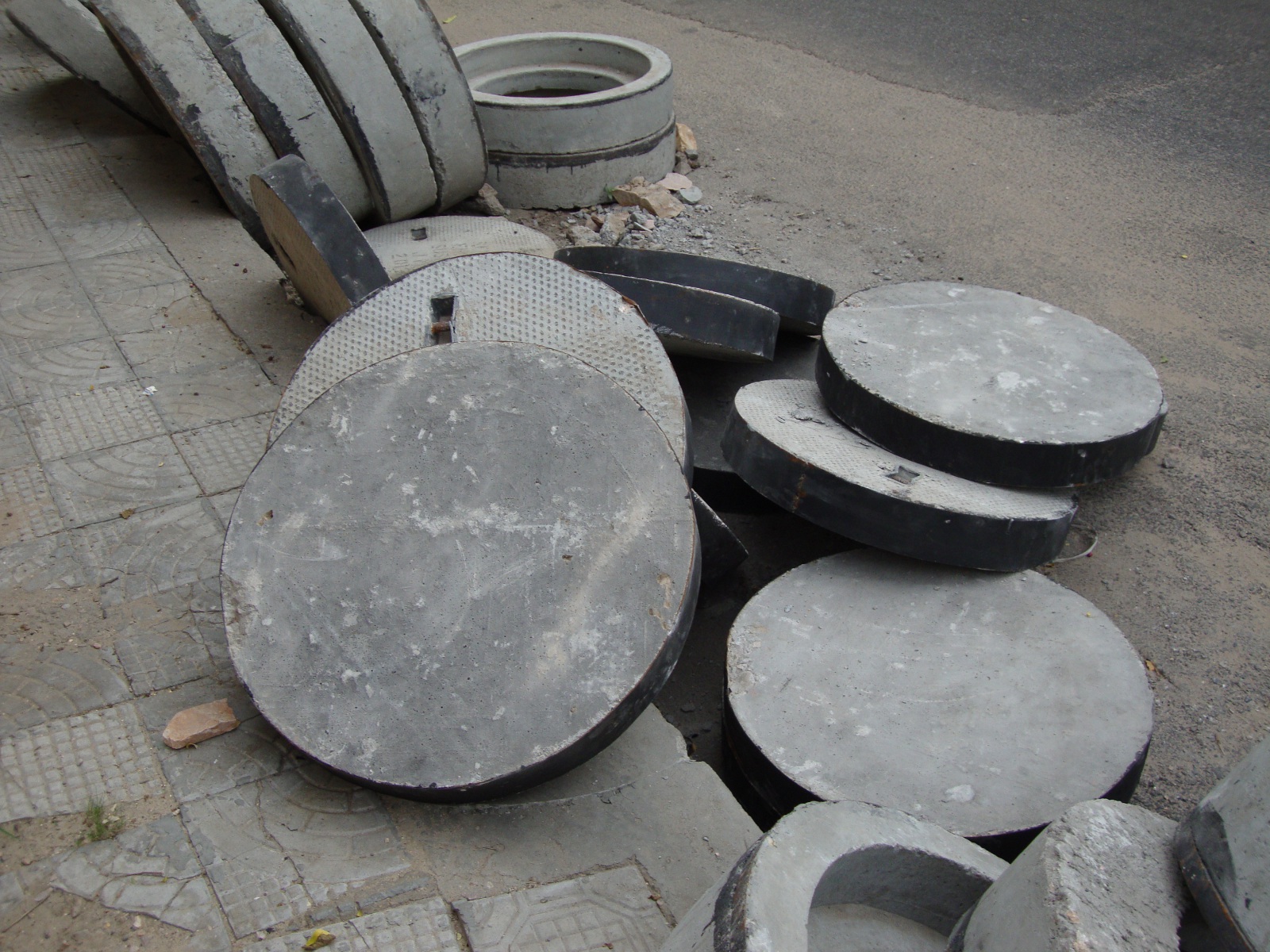 Concrete manhole covers in India.