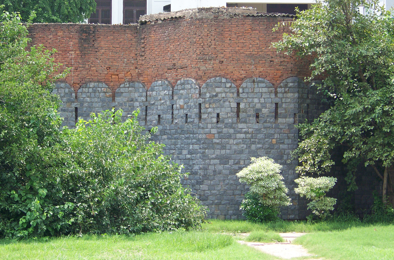 Remaining city wall serving as a retaining wall.