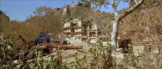 A rebel gunman scenically located in front of Jagat Shiromaniji Temple.