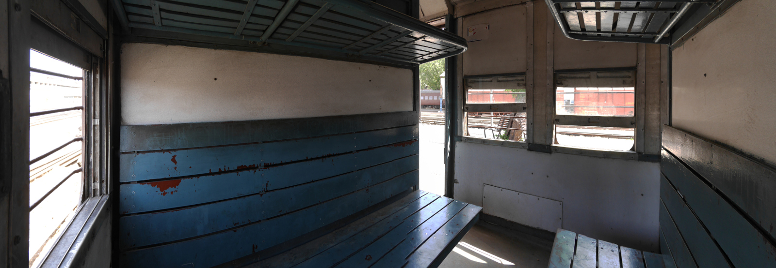 Panorama of a compartment in a meter-gauge train.