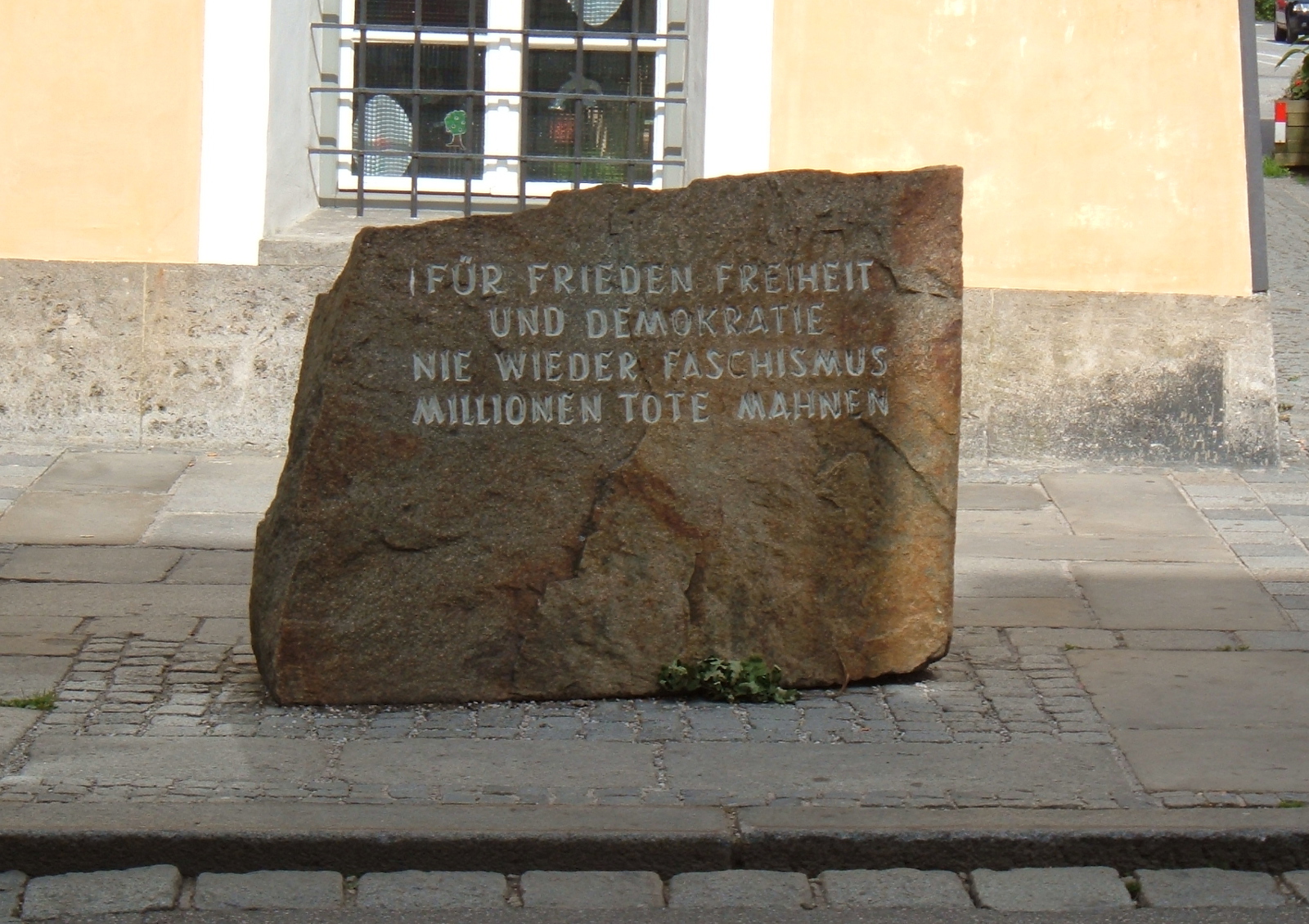 Monument in front of Hitler’s birthplace: “For peace, freedom, and democracy, never again fascism, millions of dead implore.”