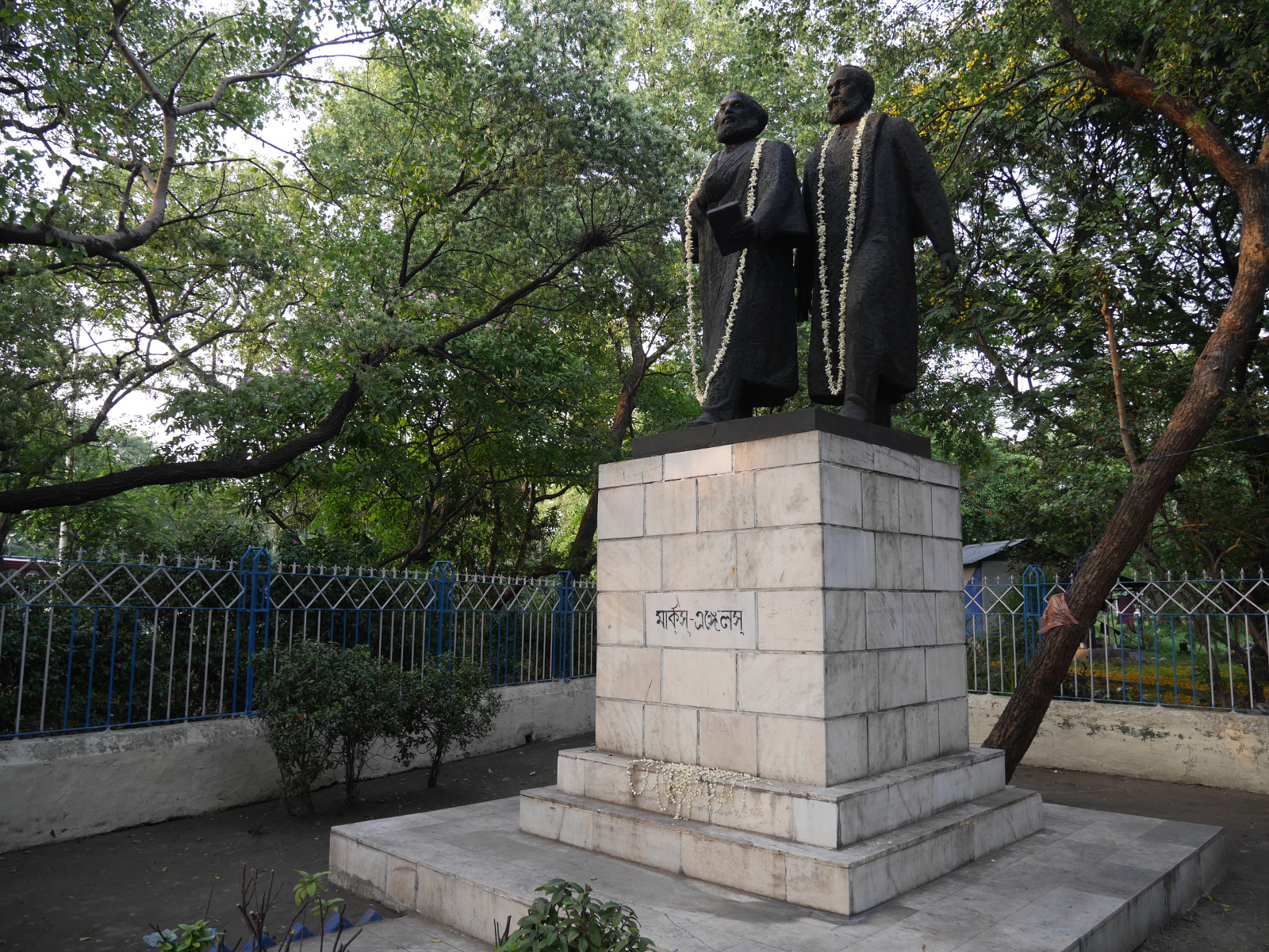 Statues of Marx and Engels freshly garlanded for May Day.