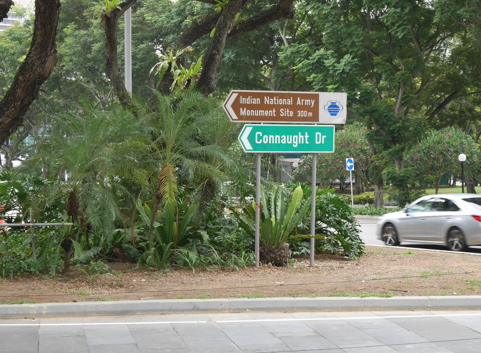 A sign on Connaught Drive, pointing to a historical marker about World War II. (The marker is located on the site of a memorial for the Japanese-affiliated Indian National Army, which was dynamited by Mountbatten’s troops after they retook Singapore in 1945.)