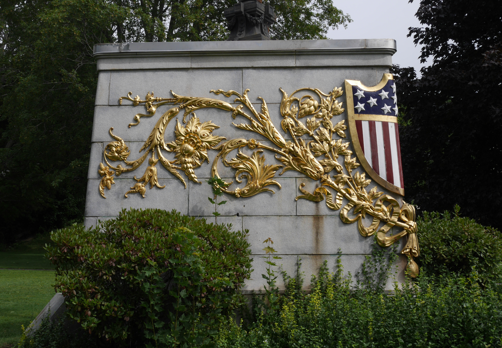 The gilded filigree that used to decorate the bow of the Maine, on a monument in Bangor.