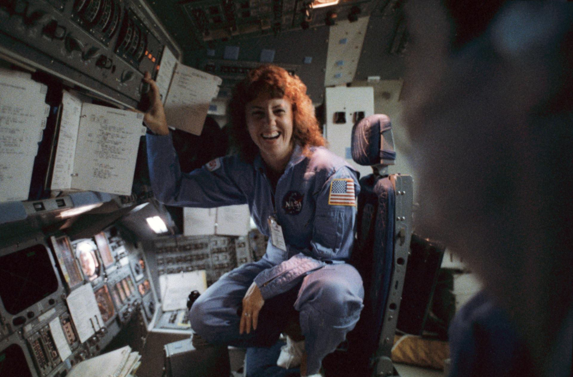 Christa McAuliffe training in the space shuttle simulator for the STS-51L mission. She would have been the first elementary teacher in space. Her backup for this mission, Barbara Morgan, later became an astronaut and flew into space on the STS-118 mission in 2007. (Source: NASA)