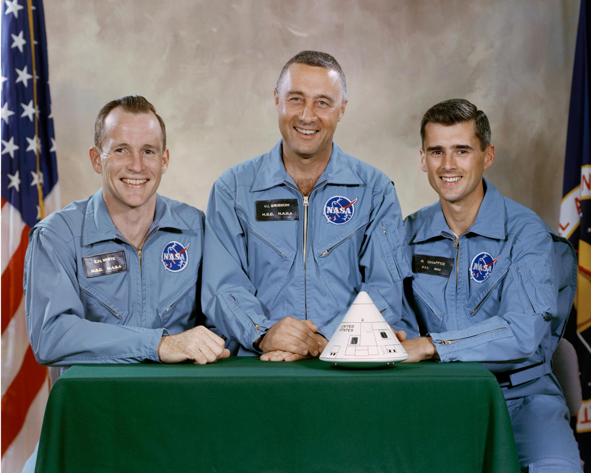 The prime crew of Apollo 1 posing with a model of their capsule (L-r): Ed White, Gus Grissom, and Roger Chaffee. (NASA photo)