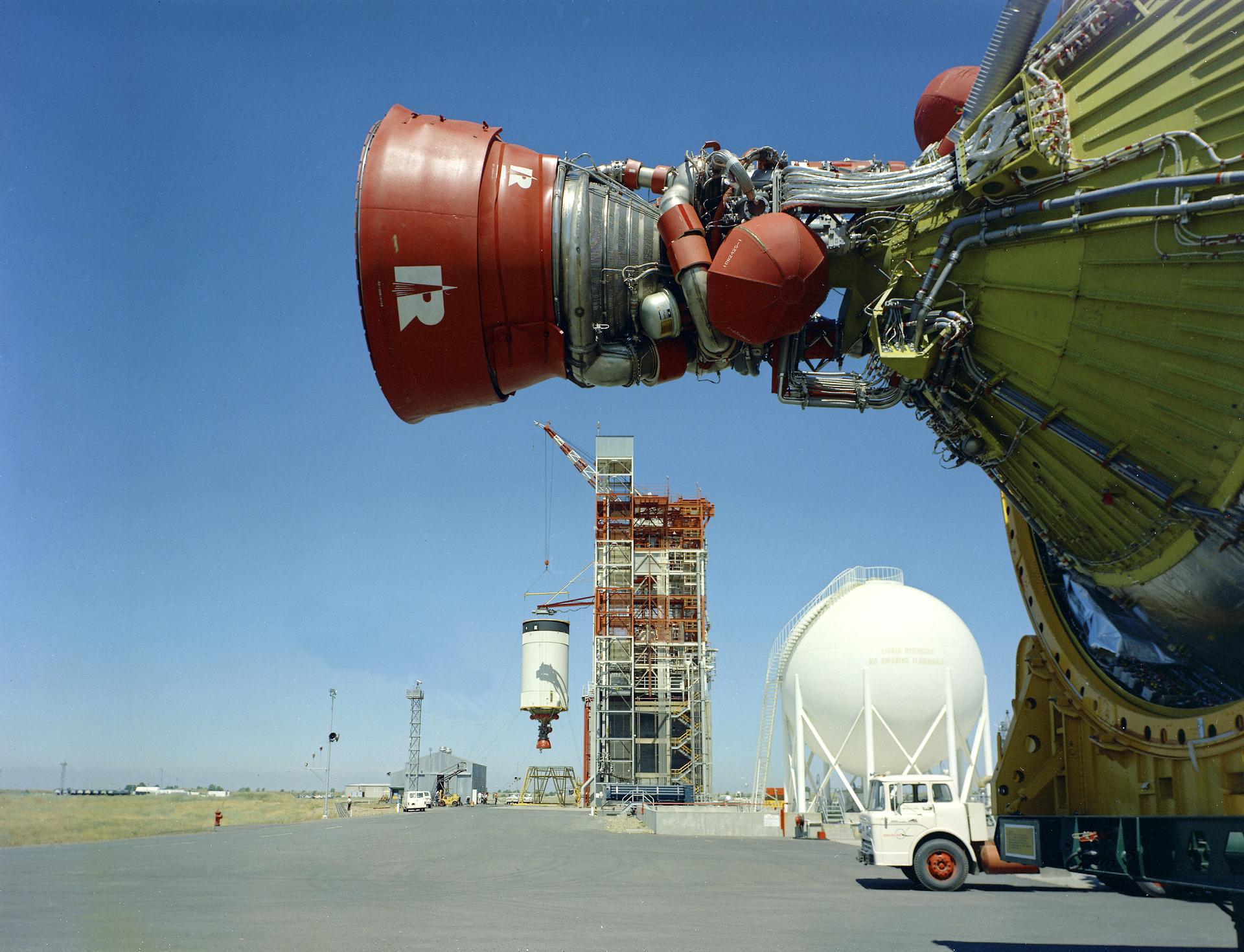 Two S-IVB stages at SACTO at the same time. The stage in the foreground was used in the Apollo-Soyuz Test Project backup vehicle. It was never flown and is now on display at Kennedy Space Center on a Saturn IB. In the background, the Apollo 9 third stage is being installed in Beta Test Stand 1 for launch. (Source: NASA)