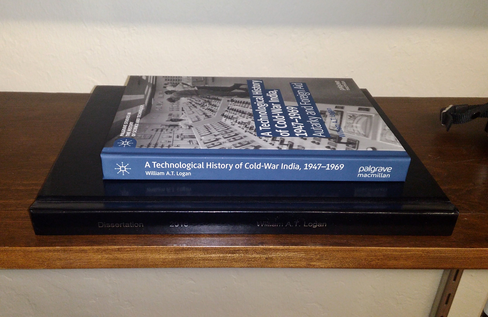 My book, A Technological History of Cold-War India, on top of my dissertation, “Building Nonalignment.”